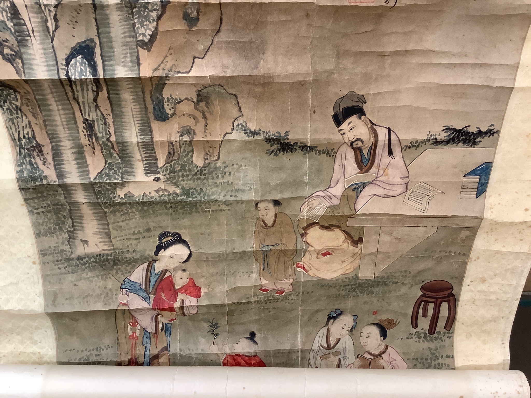 A 19th century Chinese ancestor painting, a 19th century Chinese scroll painting on paper of a sage and other figures, Image 100x 47 cm and a calligraphic scroll (3)